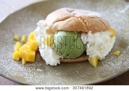 Cream Puff On A Plate In Closeup