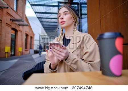 woman using smartphone in caffee shop. smart phone or mobile 