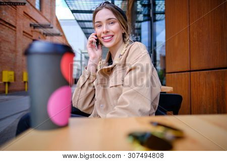 woman using smartphone in caffee shop. smart phone or mobile 