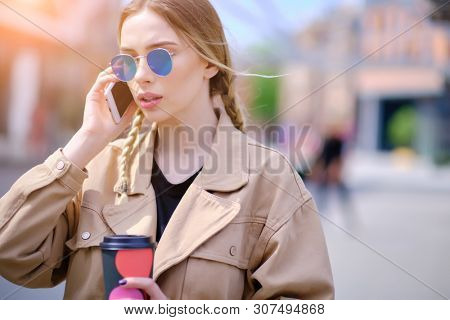 woman using smartphone in caffee shop. smart phone or mobile 