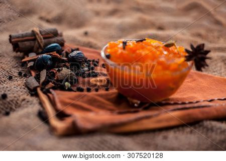 Famous Indian Dessert And Sweet Dish In A Glass Bowl On Jute Bag's Surface I.e. Murabba Or Murba Alo
