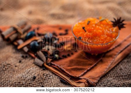 Famous Indian Dessert And Sweet Dish In A Glass Bowl On Jute Bag's Surface I.e. Murabba Or Murba Alo