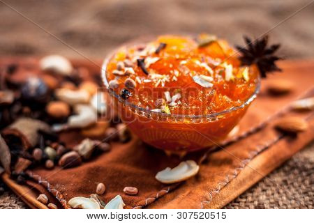Famous Mango Preservation I.e. Murba Or Murabba In A Glass Bowl On Jute Bag's Surface Along With Dry