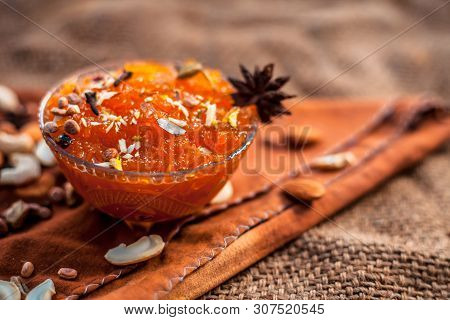 Famous Mango Preservation I.e. Murba Or Murabba In A Glass Bowl On Jute Bag's Surface Along With Dry