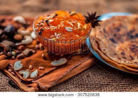 Famous Mango Preservation I.e. Murba Or Murabba In A Glass Bowl On Jute Bag's Surface Along With Dry
