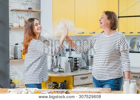Successful Family Teamwork. Mother And Daughter Enjoying Cooking Together, Giving High Five, Shackin