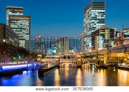 Osaka Skyscraper Building In Nakanoshima District At Night In Osaka, Japan