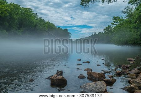 Hazy Foggy Mist On The River In The Sunny Afternoon In Summer