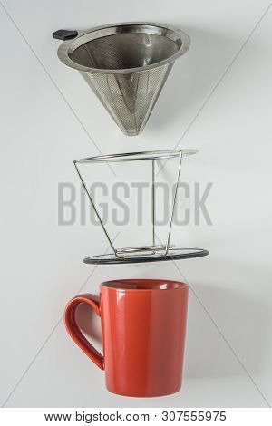 Red Coffee Mug On White Background. Metal Pour Over Drip Cone Pulled Apart.
