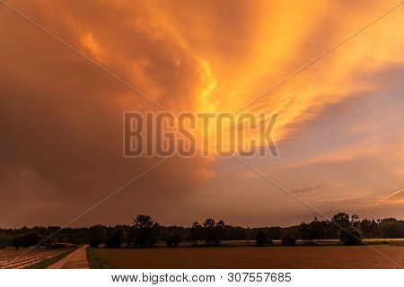 Orange Sky During Sahara Dust Storm In Europe Over Rural Area