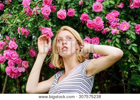 Girl Adorable Blonde Sniffing Fragrance Of Pink Bloom. Spring And Summer. Perfume And Cosmetics. Wom