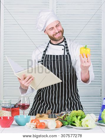 Man Bearded Chef Cooking Food. Guy Read Book Recipes. Culinary Arts Concept. Man Learn Recipe. Impro