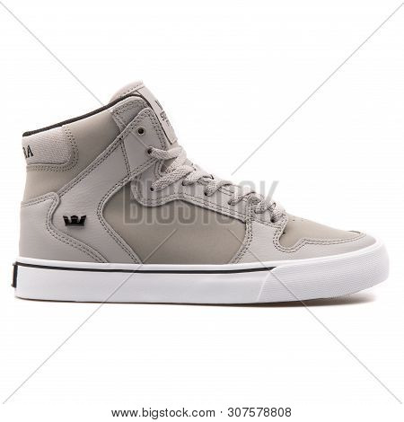 Vienna, Austria - August 25, 2017: Supra Kids Vaider Grey Sneaker On White Background.
