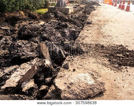 The Road Repairing Works With Jackhammer. Machine Drills Asphalt