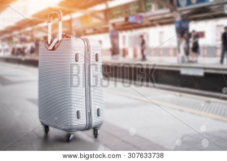 Sillver Suitcases Or Baggage At Blurred Of Sky Train Station Platform With Network Line For Connecte