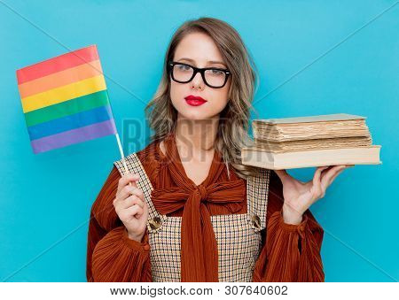 Young Woman With Books And Lgbt Flag On Blue Bckground