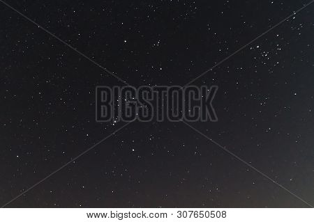 Underexposed Night Sky Low Light Photo. A Lot Of Stars And Constellations On Dark Sky. Stock Photo O