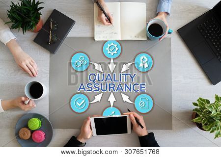Quality Assurance Control Guarantee Customer Service Satisfaction Concept On Office Desktop.
