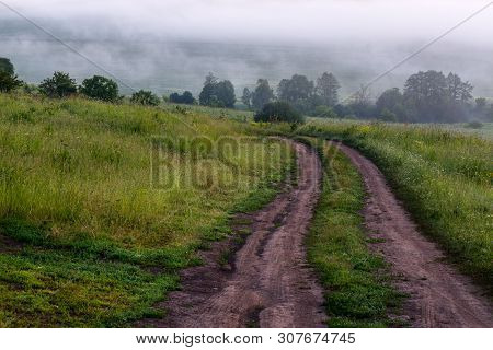 Dry Summer Dirt Road At Misty Morning Outdoors