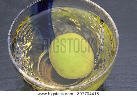 Japanese Plum Wine Called Umeshu, On Drak Background