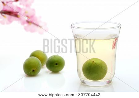 Japanese Plum Wine Called Umeshu On White Background