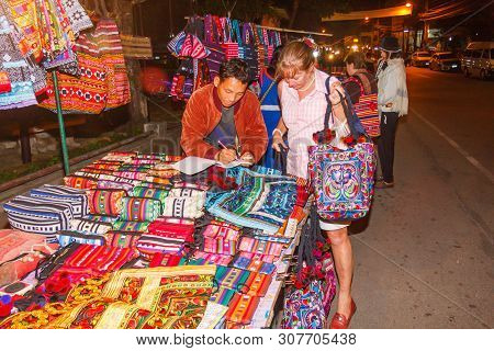 Mae Hong Son, Thailand - November 21st 2011: Senior Woman Buying Hilltribe Products, Night Market Th