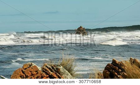 Red Rocks At The Arthur River Mouth On The West Coast Of Tasmania
