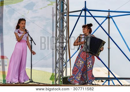 Performance Of Artists With A Vocal Number To The Accompaniment Of The Accordion At The Celebration