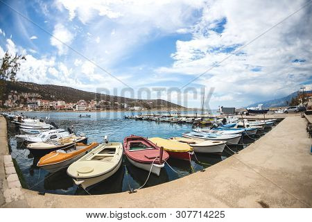 Motor Boats On The Pier. Sea Coast Of Croatia. Swimming Facilities By The Sea. Yachts And Sailboats 