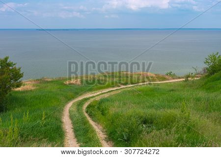 Spring Landscape With An Earth Road Leading To Kakhovka Reservoir Located On The Dnipro River, Ukrai