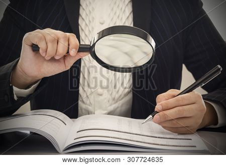 Corruption Audit Concept. Inspector Using Magnifying Glass For Inspect Budget Corruption.
