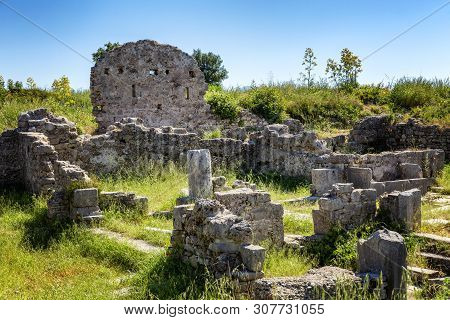 Antique Ruins In The Park On A Bright Sunny Day.