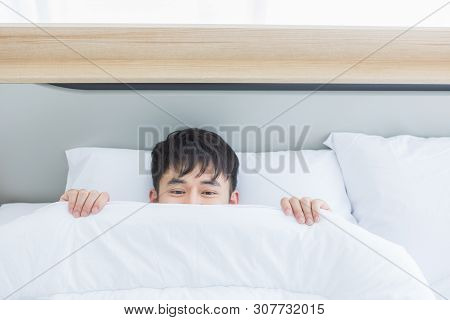 Close Up Shot Of Asian Handsome Man Lying On Comfort Bed, He Slept Deep In Bedroom.