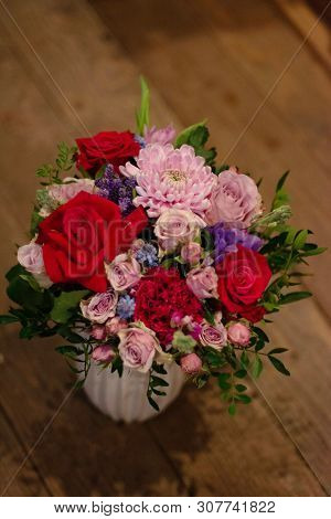 Bouquet Of Flowers On A Leg In The Interior Of The Restaurant For A Celebration Shop Floristry Or We