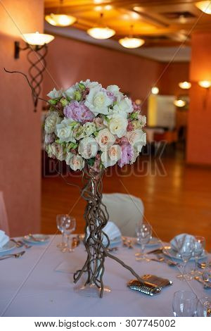 Bouquet Of Flowers On A Leg In The Interior Of The Restaurant For A Celebration Shop Floristry Or We