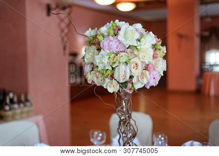 Bouquet Of Flowers On A Leg In The Interior Of The Restaurant For A Celebration Shop Floristry Or We