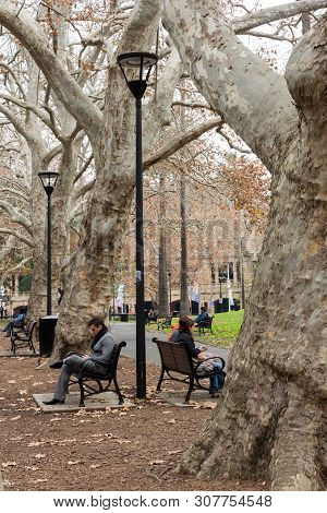 Sydney, Australia - June 15th 2015: People Sat Relaxing In Belmore Park. The Park Is Adjacent To The