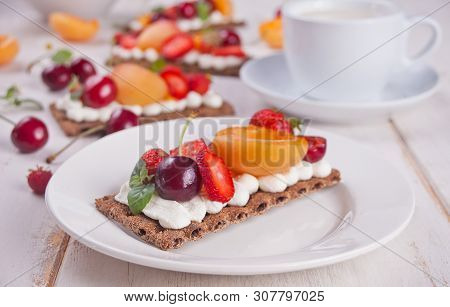 Crisp Bread With Creme Cheese, Fruit And Berries