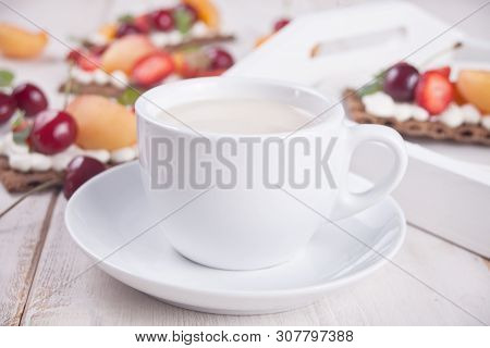 Cup Of Tea And Crisp Bread With Creme Cheese, Fruit And Berries
