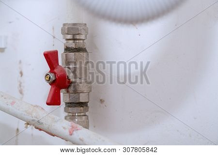 Tap With Red Handle On White Plastic Water Pipe