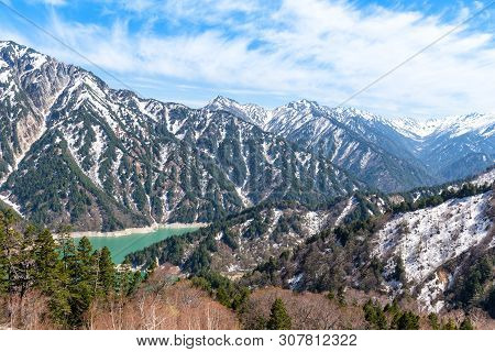 Snow Mountain Range And Kurobe Lake At Tateyama Kurobe Alpine Route.
