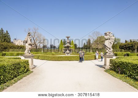 Lednice, Czech Republic - April 22, 2019:tourist In Park Next To Castle Lednice On April 22,2019 In 