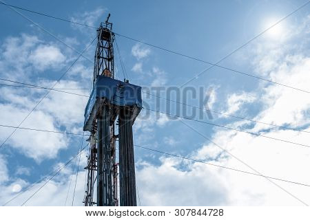 Drilling Rig In Oil Field For Drilled Into Subsurface In Order To Produced Crude. Petroleum Industry