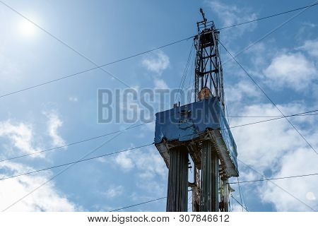 Drilling Rig In Oil Field For Drilled Into Subsurface In Order To Produced Crude. Petroleum Industry