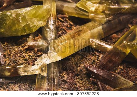 Yellow And Brown Quartz Crystal Shards Embedded In Mineral Rock