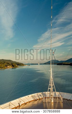 Pointed Bow Of Cruise Ship , Southbound On Ocean Channel, Alaska Inside Passage, In Warm Afternoon S