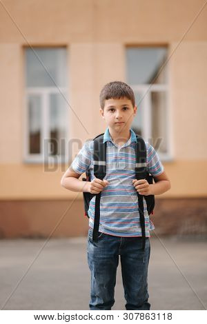 Cute Little Boy With Backpack Go Home After Scholl Class