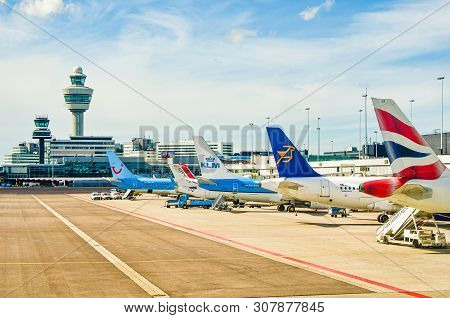 Amsterdam, Netherlands - April 11, 2012. Airplanes Parked On Schiphol Airport.