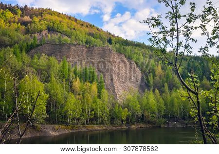 Beautiful Spring Mountain Landscape. Quarry In The Mountains By The Lake.