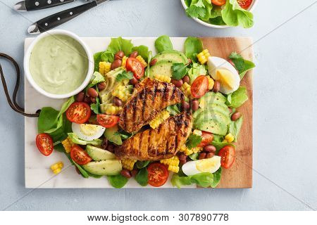 Cobb Salad With Chicken, Avocado, Tomato, Eggs And Corn.